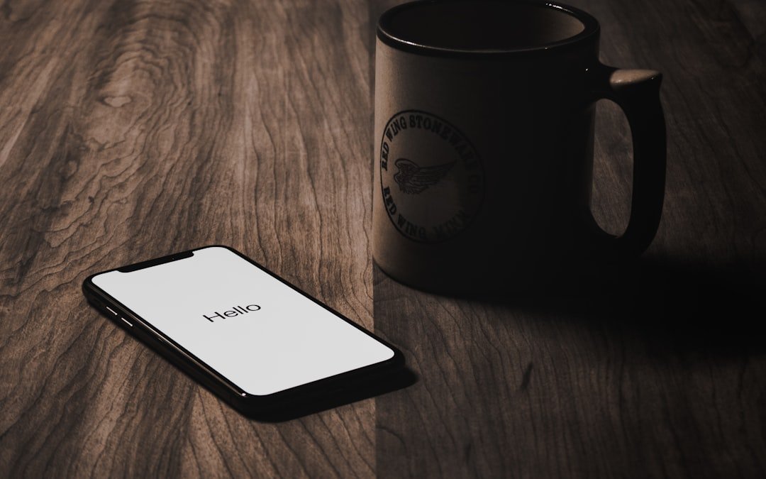 Digital detox: Iphone x on tabletop beside mug