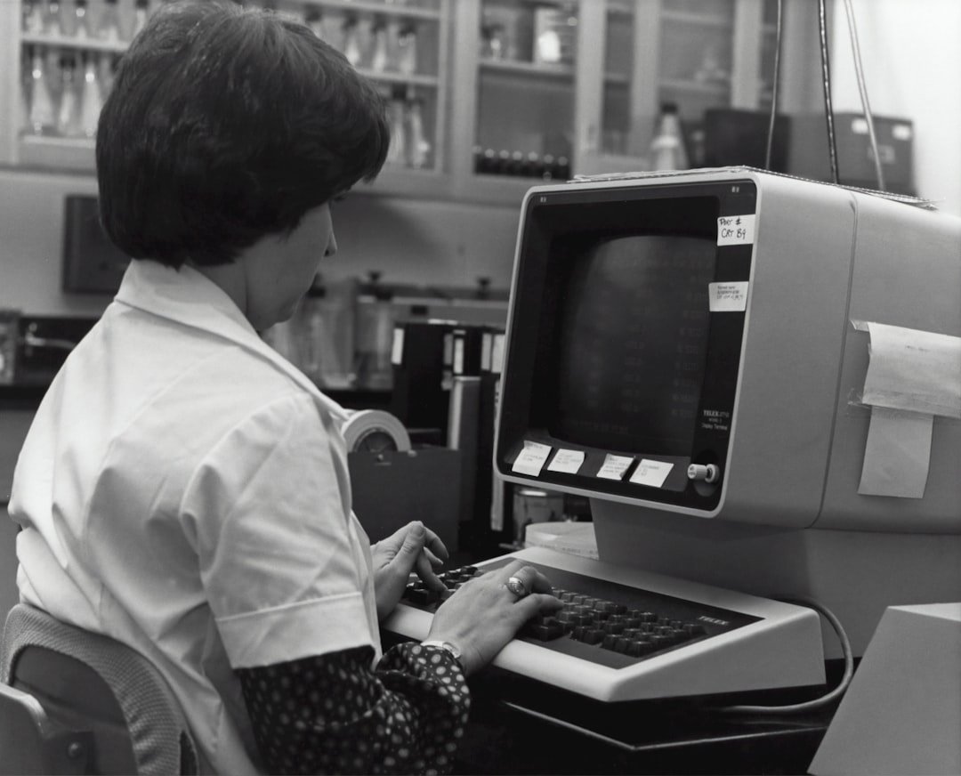 Grayscale photography of unknown person using computer