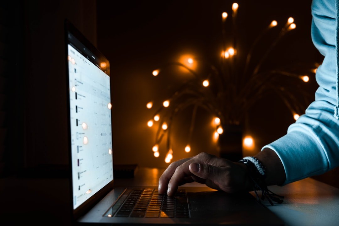 Person using black laptop computer