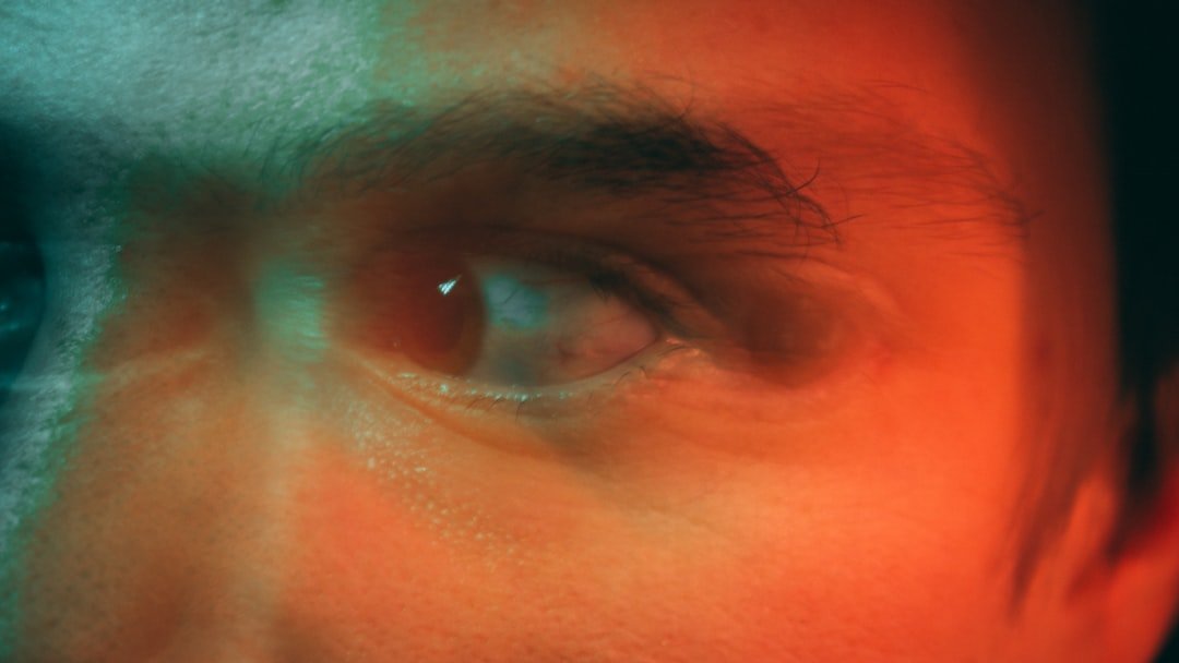 A close up of a man's face with a blurry background