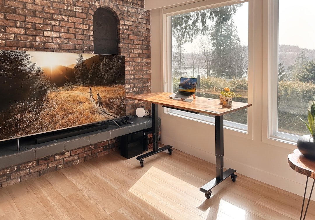 A flat screen tv sitting on top of a wooden table