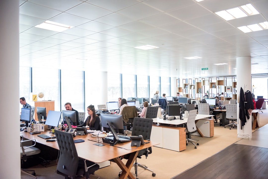 People working at desks in open office