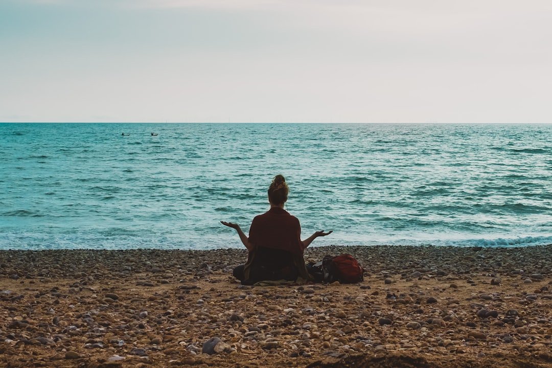 Vagus nerve: Person doing yoga on seashore during daytime