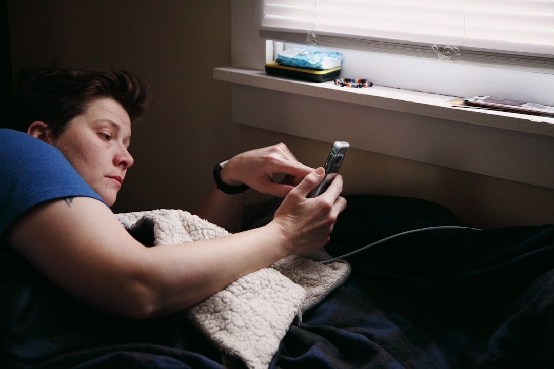 Dopamine detox: Man in black shirt holding black smartphone