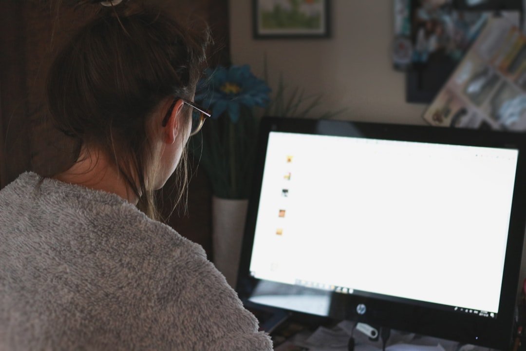 Woman in front of computer monitor
