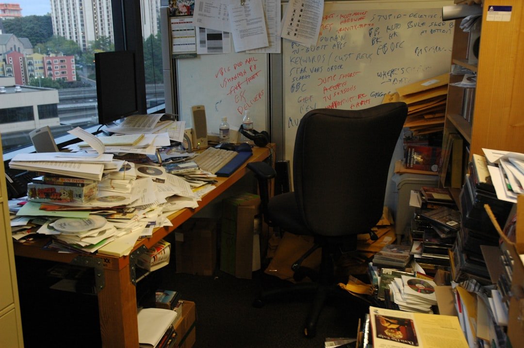 Office table with pile of papers