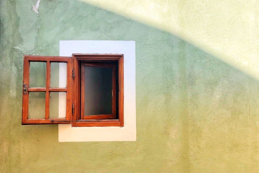 Opened brown wooden window