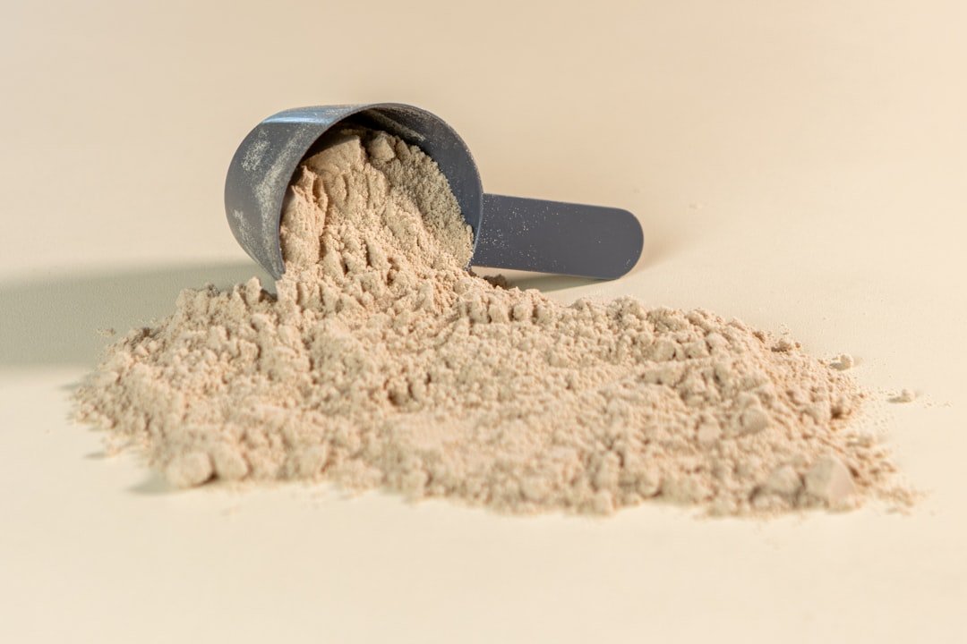 A scoop of powder sitting on top of a table