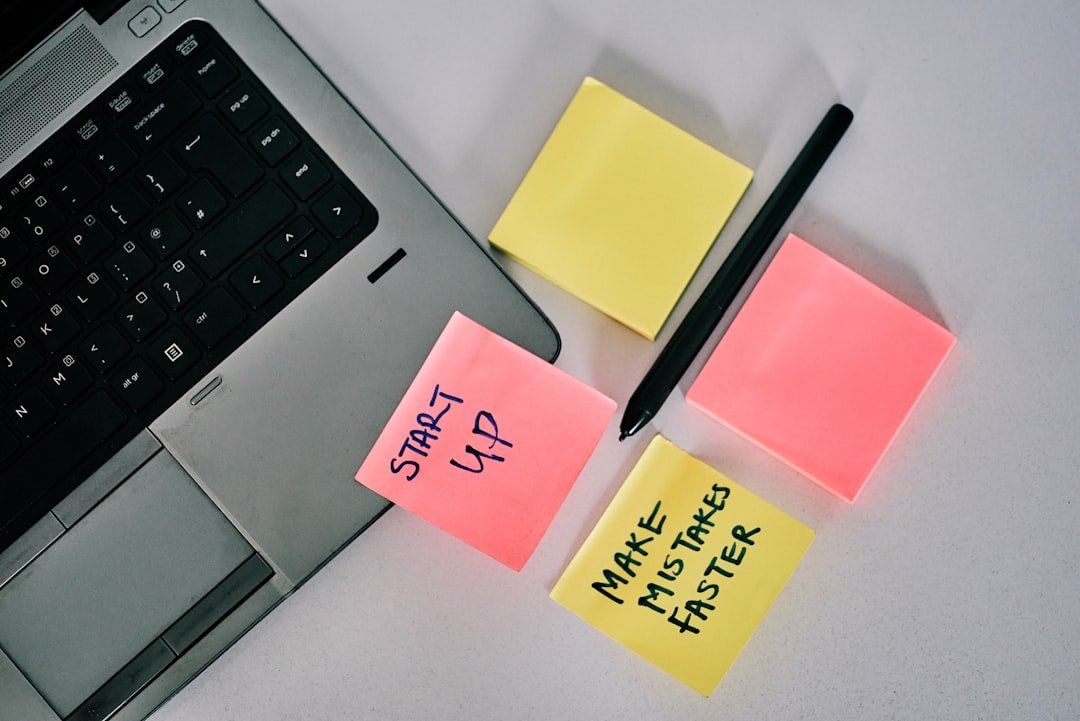 Yellow sticky notes on laptop computer