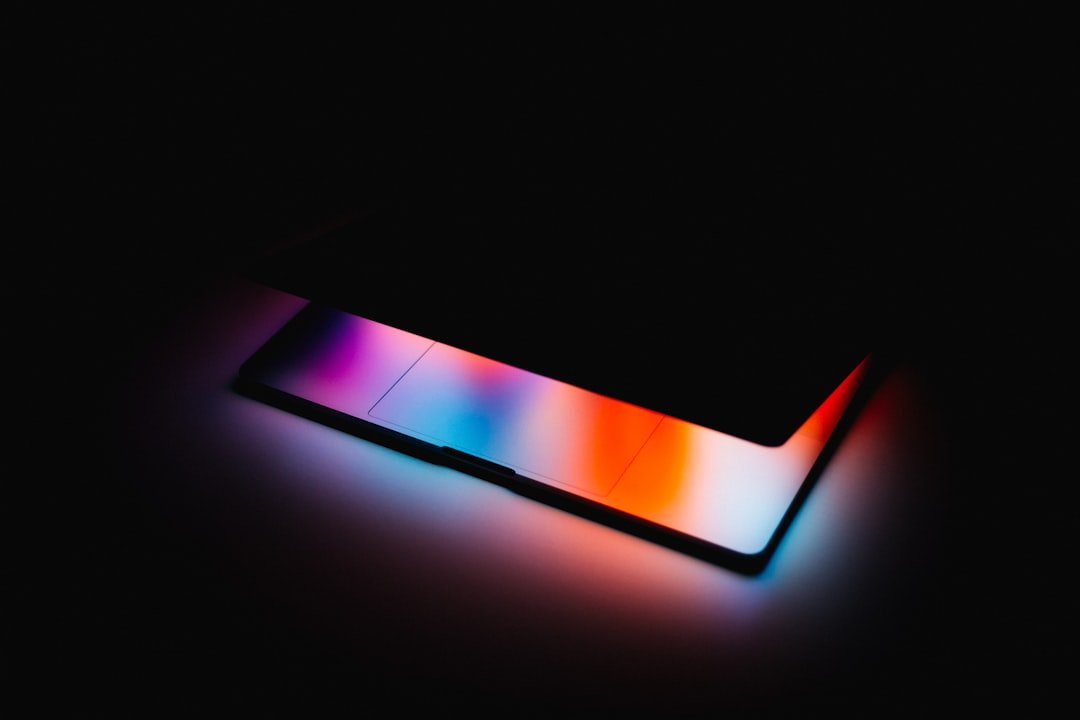 A close up of a cell phone in the dark