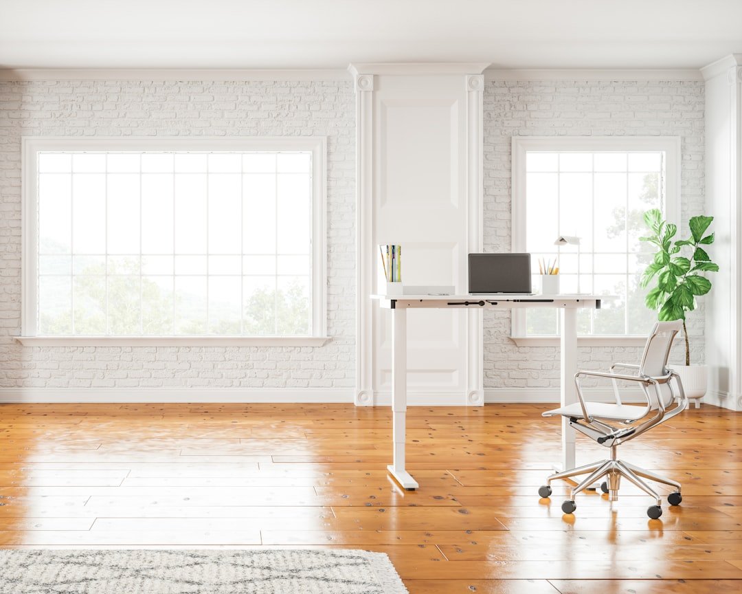 White and black area rug on brown wooden floor