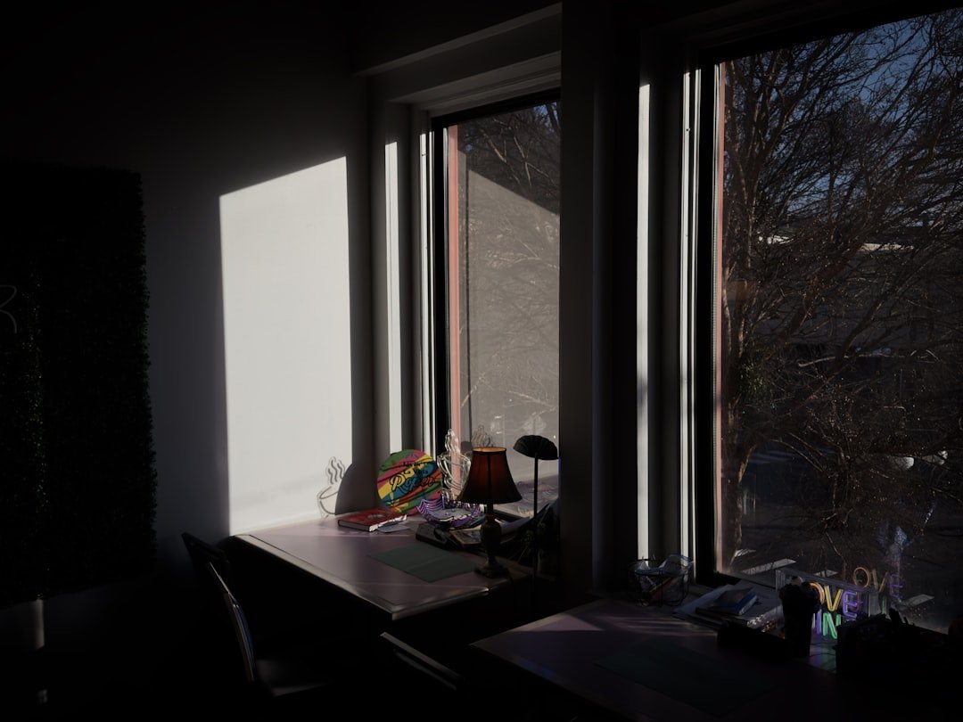 Sunlight streams through a window onto a desk