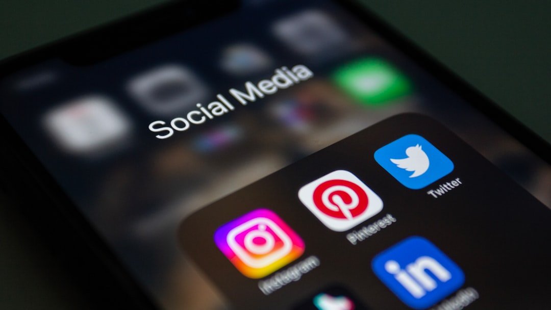 A close up of a cell phone with social media icons on it