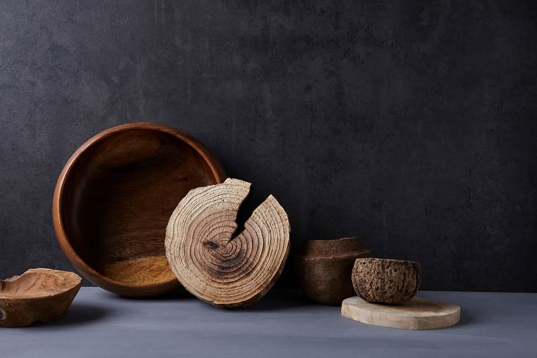 Brown wooden round bowl on white table