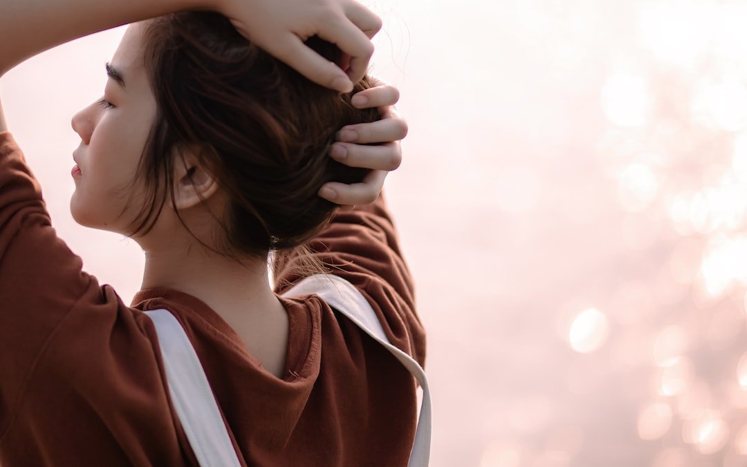 A person holding the hair