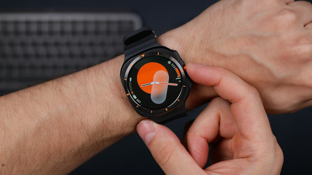 A close up of a person holding a smart watch