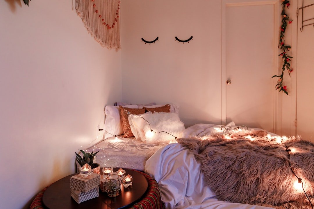 White wooden cabinet near bed