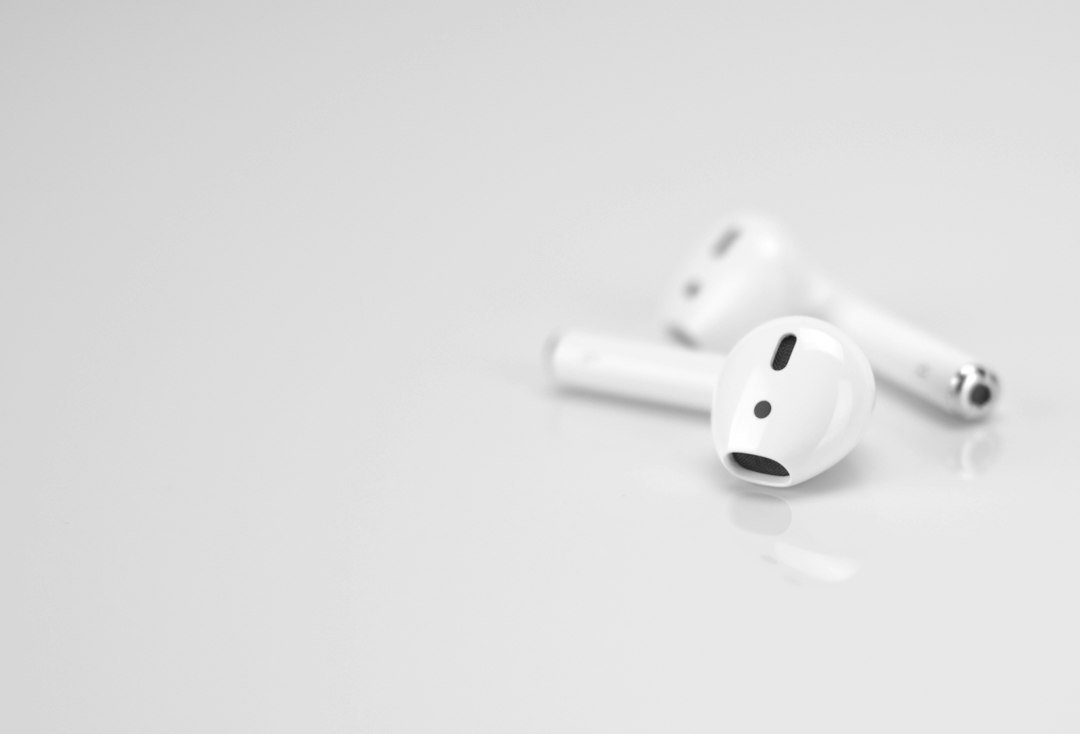 Apple airpods on white surface