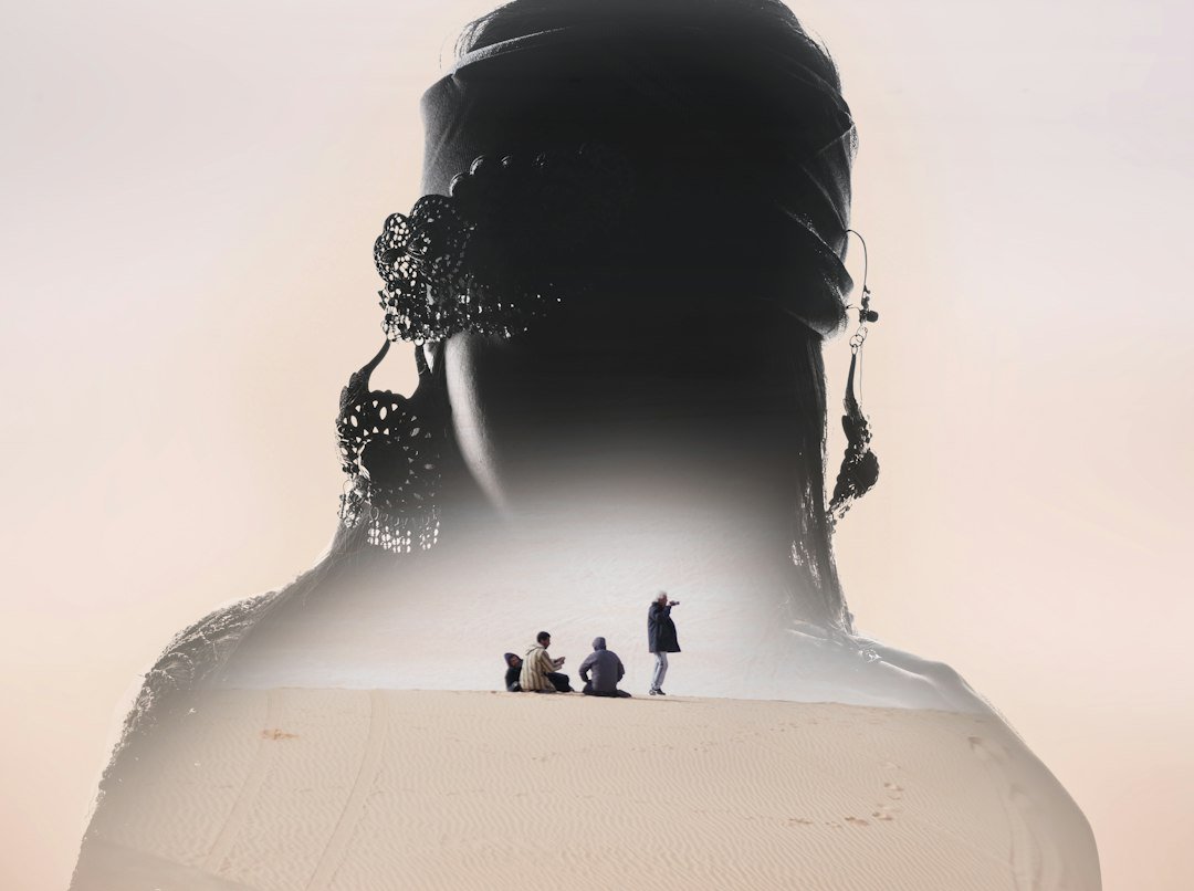 Three person on shore during daytime