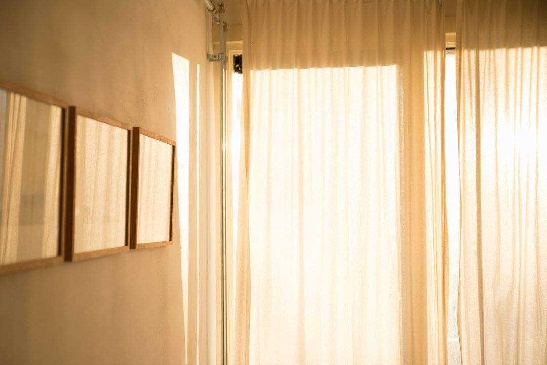 Room with white window curtains